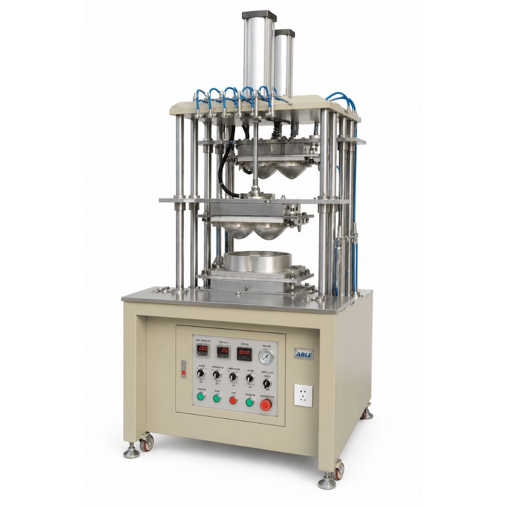 Foam bra cup molding machine with heated cup molds and vacuum